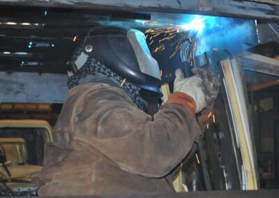 Welder working inside the car