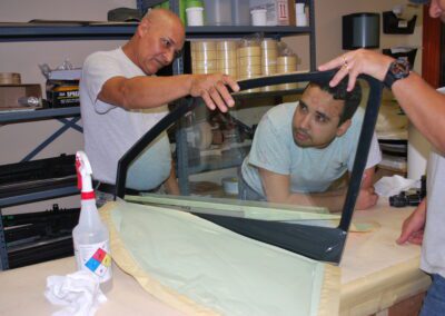 Workers looking at the window glass